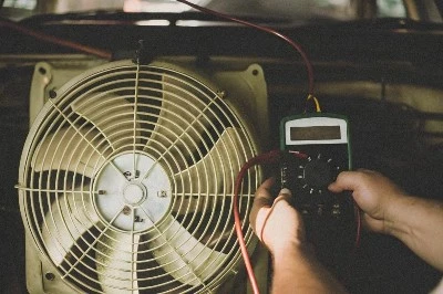 a-close-up-shot-of-a-car-radiator-fan-with-an-amme a-close-up-shot-of-a-car-radiator-fan-with-an-amme